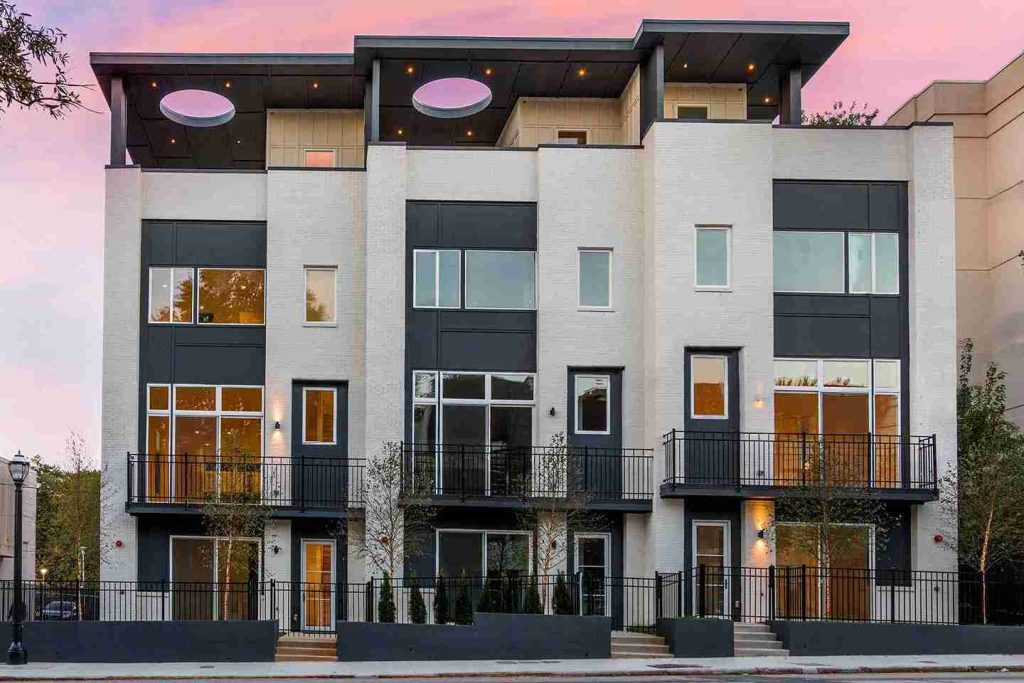 Contemporary townhome with black and white facade and rooftop terrace
