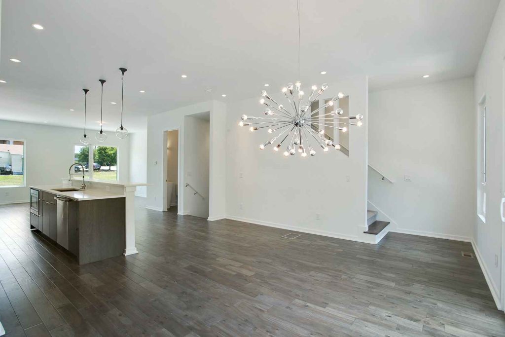 71 Lucy Street The Edge open floor plan with kitchen island and chandelier